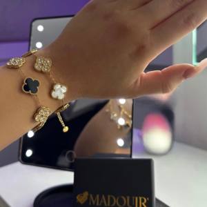 Elegant adjustable gold and white bracelet with clover design