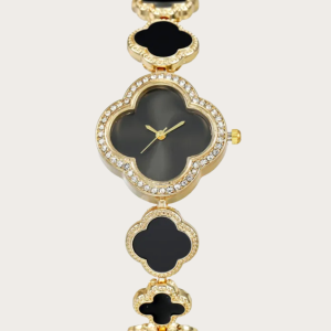 Black clover-shaped watch with gold-tone finish and adjustable bracelet.