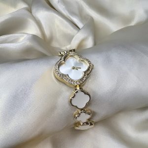 White clover-shaped watch with gold-tone finish and adjustable bracelet.