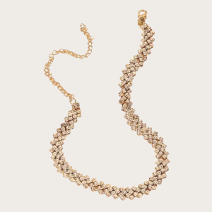 Gold rhinestone necklace with zigzag crystal design.