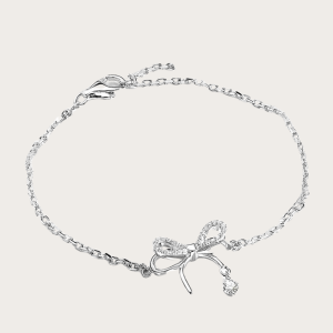 Shira Bow Bracelet in silver with sparkling rhinestones, adding a fairy tale charm to your look.